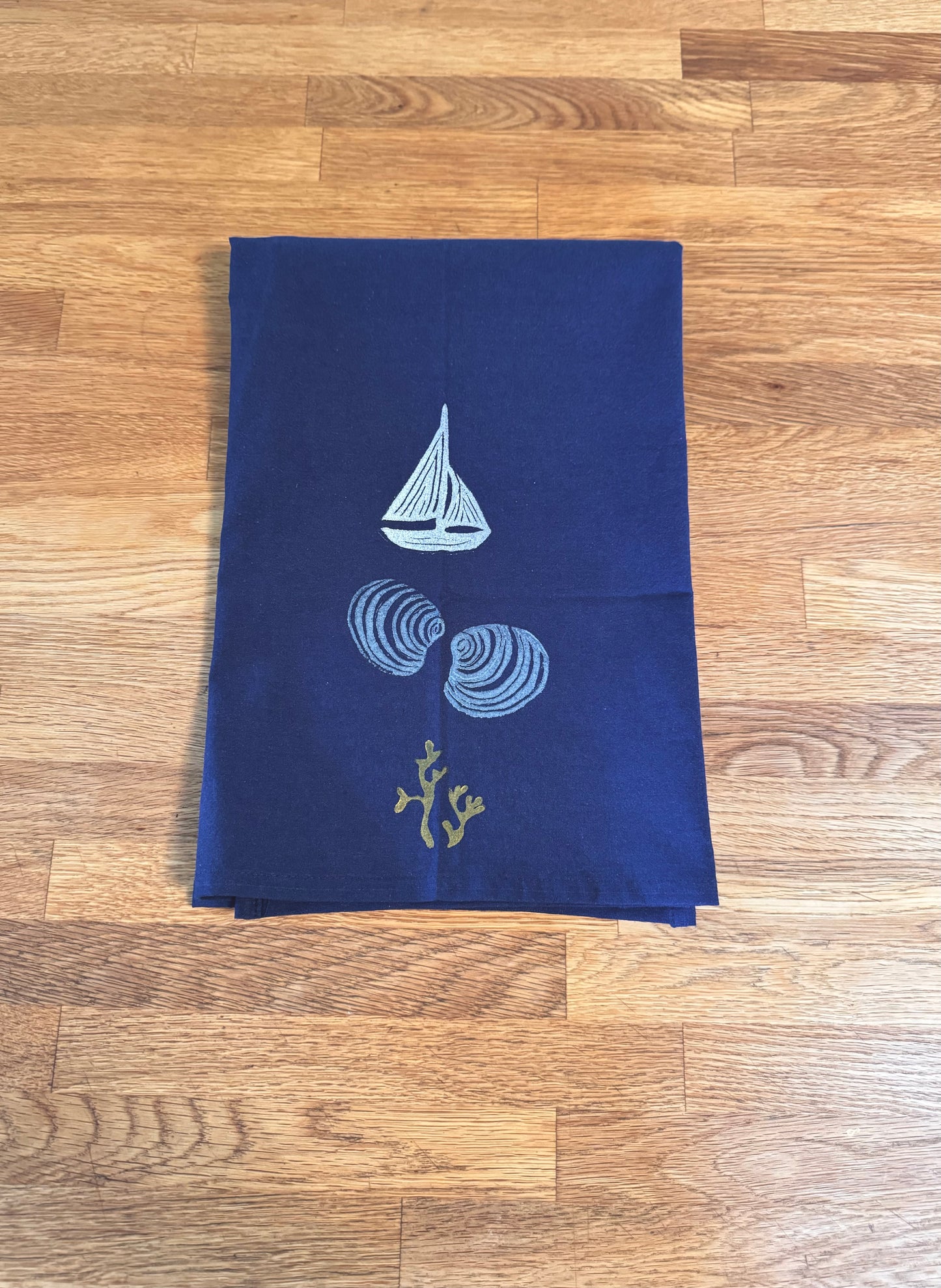 Deep blue tea towels with sailboat and shells